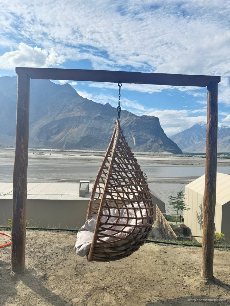 Hanging chair on a terrace at Khoj Resort overlooking the Indus river, Shigar