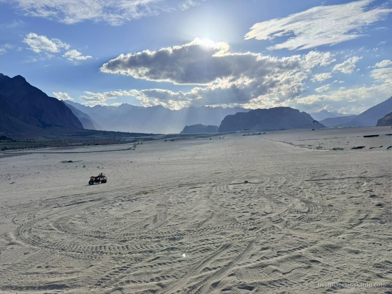 Sand dunes of the Sarfaranga cold desert near Skardu with snow-capped Karakoram peaks behind