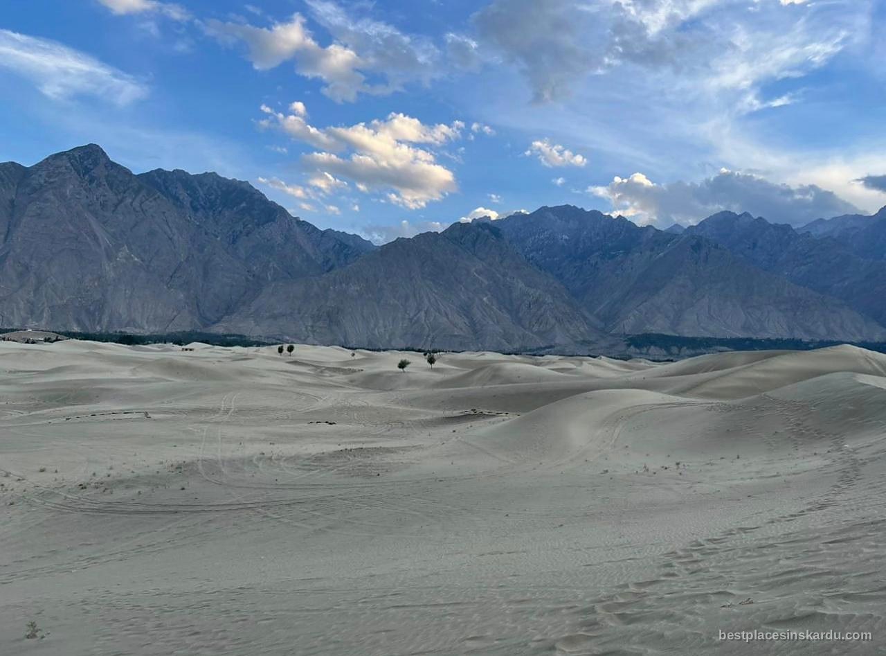 Sand dunes of the cold desert near Skardu with snow-capped Karakoram peaks behind