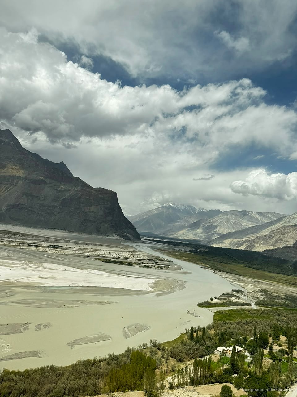 Green irrigated fields of Shigar valley against bare mountains, Gilgit-Baltistan