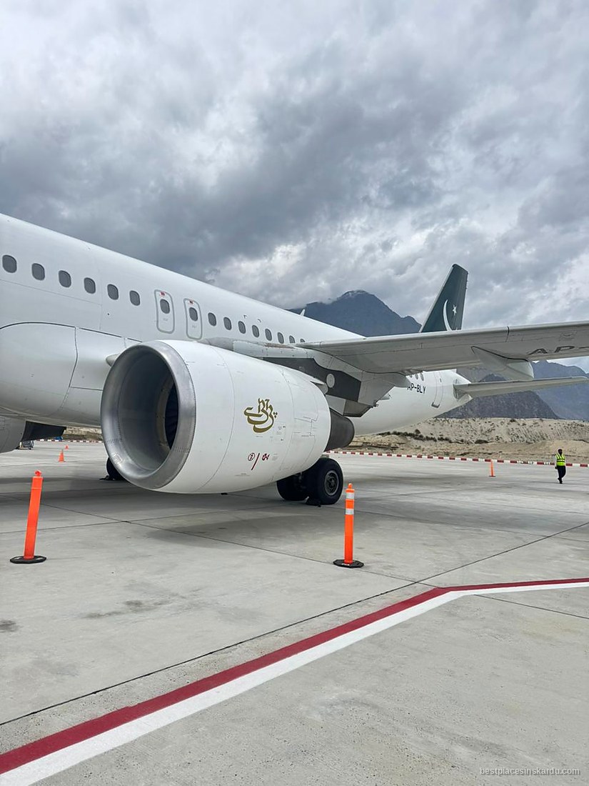 PIA Airbus on the apron at Skardu International Airport with the Karakoram behind